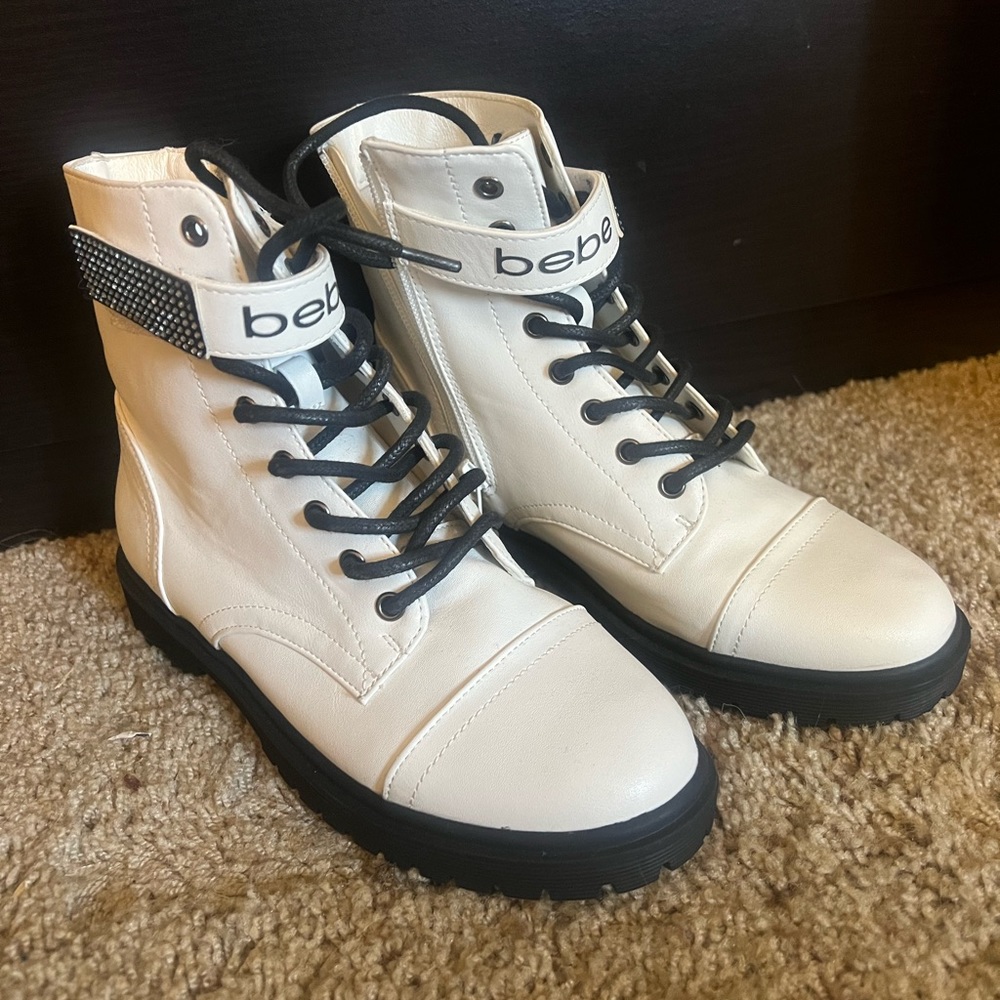 Brand new. Never worn. Size 6 Bebe combat style boot.